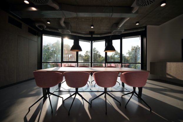 Board room with table and chairs, all empty